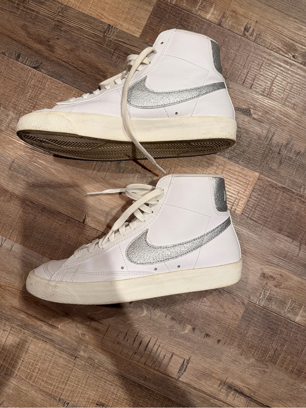 Nike Women's White High-Top Sneakers with Silver Swoosh Accent